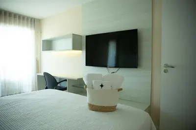Uma cama ou camas num quarto em Resort Completo - 6 min do Beach Park
