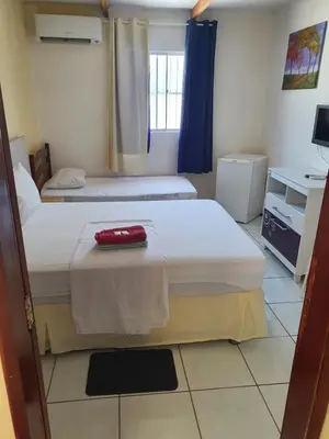 Uma cama ou camas num quarto em Dias de Sol & Mar