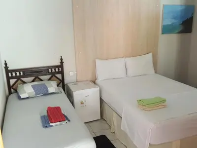 Uma cama ou camas num quarto em Dias de Sol & Mar