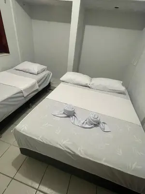 Uma cama ou camas num quarto em Pousada Casa Bali