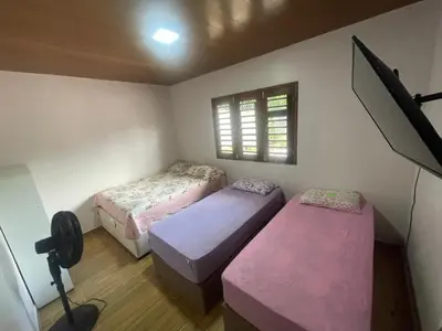 Uma cama ou camas num quarto em Recanto do Céu