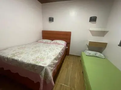 Uma cama ou camas num quarto em Recanto do Céu