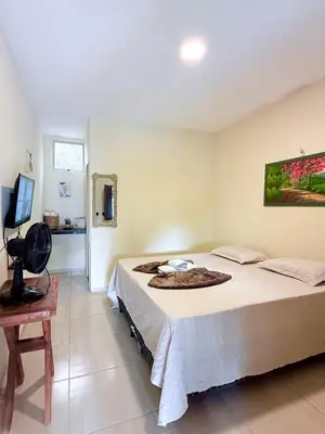 Uma televisão e/ou sistema de entretenimento em Pousada Santa terezinha