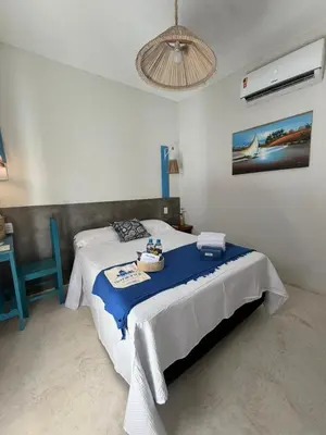 Uma cama ou camas num quarto em Pousada Villa Santorini Preá