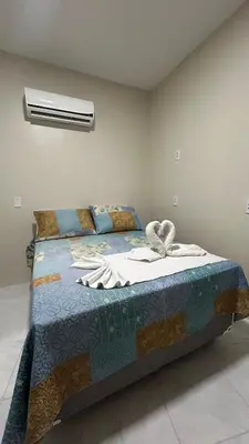 Uma cama ou camas num quarto em Pousada Novo Amanhecer
