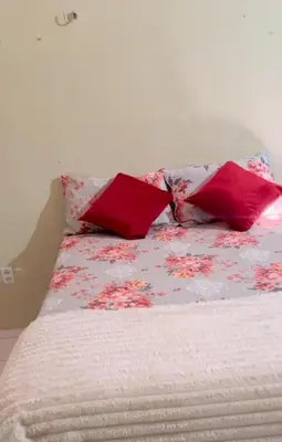 Uma cama ou camas num quarto em Aconchego Feliz