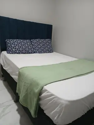 Uma cama ou camas num quarto em Mikeias sousa