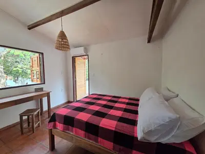 Uma cama ou camas num quarto em Casa ma cherie lagoa do paraiso