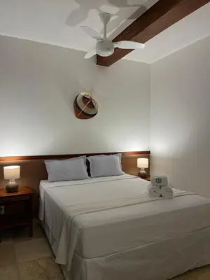 Uma cama ou camas num quarto em Pousada Maresia
