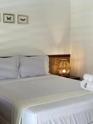 Uma cama ou camas num quarto em Pousada Maresia