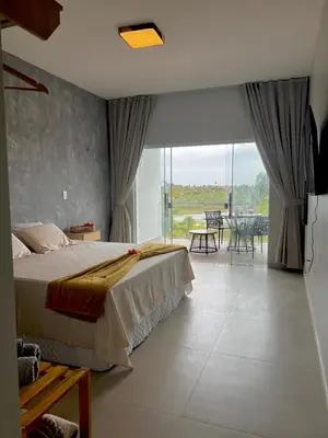 Uma cama ou camas num quarto em Villa brisa Icaraízinho quarto 8 1 andar