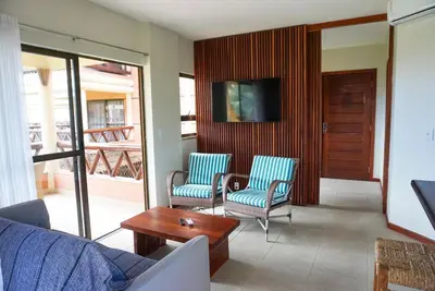 Uma televisão e/ou sistema de entretenimento em Cumbuco Dream Village 802V - Vista e brisa do mar