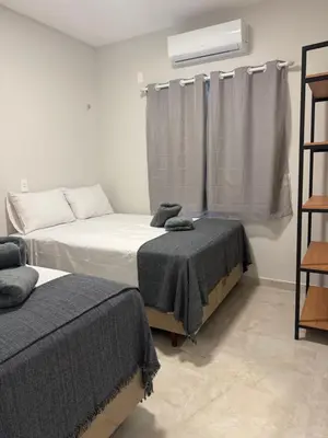 Uma cama ou camas num quarto em Sunset House Canoa Quebrada