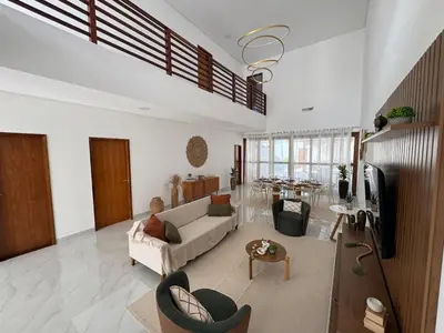 Uma televisão e/ou sistema de entretenimento em Casa - Elo Beach House