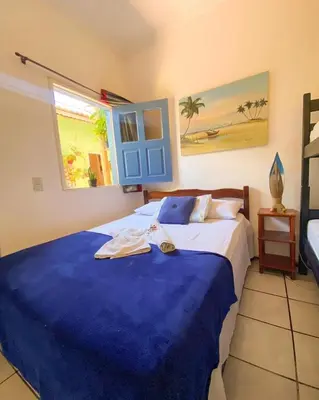 Uma cama ou camas num quarto em Villa Jerico Pousada
