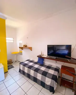 Uma televisão e/ou sistema de entretenimento em Villa Jerico Pousada