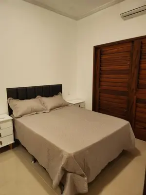 Uma cama ou camas num quarto em Dúplex Lagoa