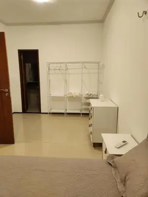 Uma cama ou camas num quarto em Dúplex Lagoa