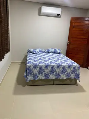 Uma cama ou camas num quarto em Casa Azul em Flecheiras