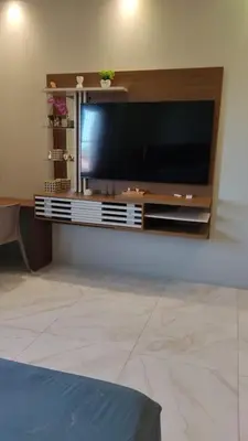 Uma televisão e/ou sistema de entretenimento em Trairí House