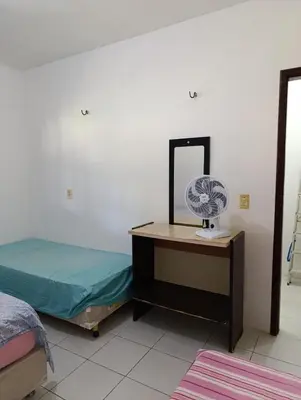 Uma cama ou camas num quarto em Presídio Beach House