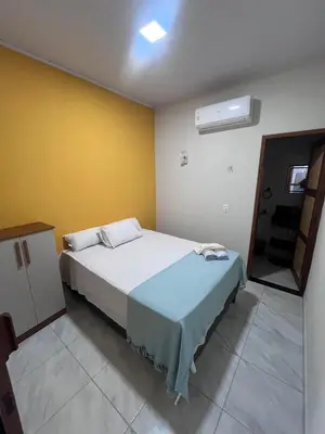 Uma cama ou camas num quarto em Chalés do mar