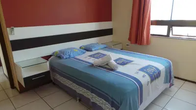 Uma cama ou camas num quarto em Emilio Hinko 3 Quartos apto1502