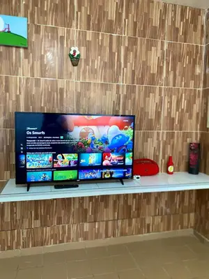 Uma televisão e/ou sistema de entretenimento em Green House Cumbuco