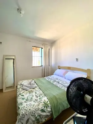 Uma cama ou camas num quarto em Green House Cumbuco