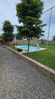 A piscina em ou perto de Casa de praia com campo de futebol e piscina