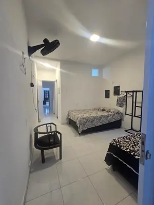 Uma cama ou camas num quarto em Casa Maúna