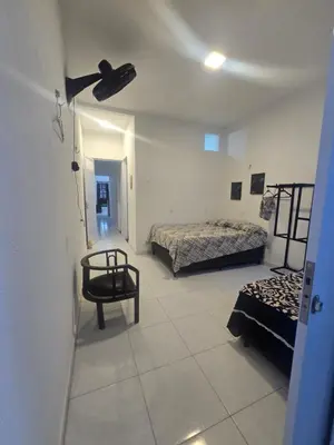 Uma cama ou camas num quarto em Casa Maúna