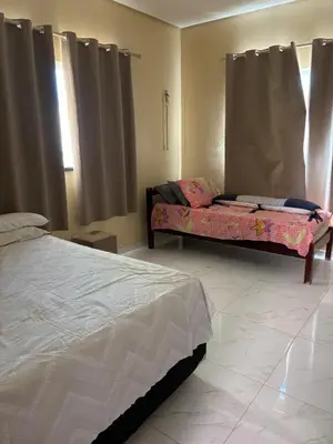 Uma cama ou camas num quarto em Casa Paracuru