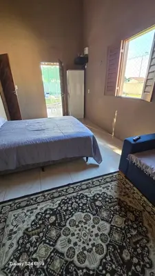 Uma cama ou camas num quarto em Casa de praia com campo de futebol e piscina