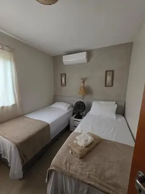 Uma cama ou camas num quarto em Dream Village 501H - Frente mar dos sonhos!