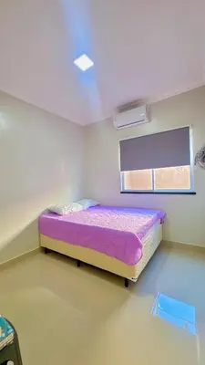 Uma cama ou camas num quarto em CASA MARIANNA - Paracuru perto de tudo 3qts piscina