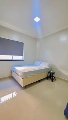 Uma cama ou camas num quarto em CASA MARIANNA - Paracuru perto de tudo 3qts piscina