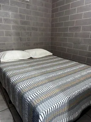 Uma cama ou camas num quarto em Aconchego