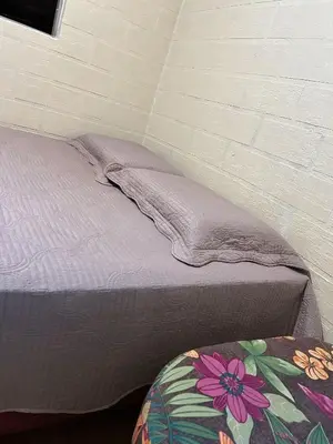 Uma cama ou camas num quarto em Aconchego