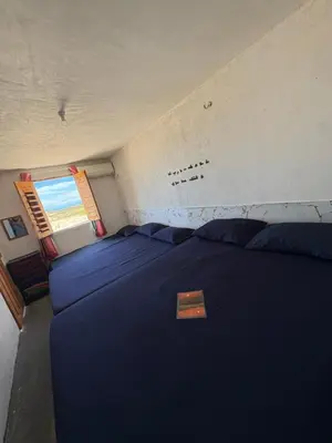 Uma cama ou camas num quarto em Por do sol residence