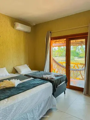 Uma cama ou camas num quarto em Icaraizinho House