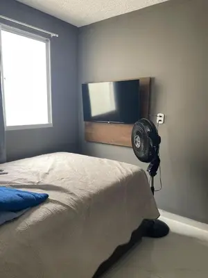 Uma cama ou camas num quarto em Viva Praia do Futuro - Apartamento Moderno