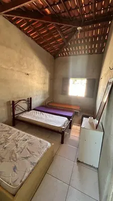 Uma cama ou camas num quarto em Casa no Paracuru
