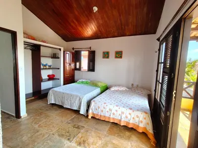 Uma cama ou camas num quarto em Nascimento BEACH
