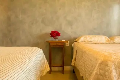 Uma cama ou camas num quarto em Casa Angatu Mansão paradisíaca no Preá