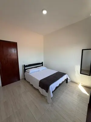 Uma cama ou camas num quarto em Residencial Poeira no Mar apto
