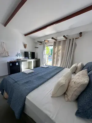 Uma cama ou camas num quarto em BaleiaLofts Kite Village