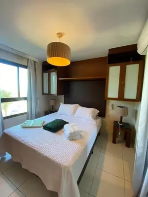 Uma cama ou camas num quarto em Vila Galé SUN - PÉ NA AREIA