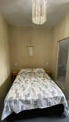 Uma cama ou camas num quarto em Apartamento completo no Preá - RESIDENCIAL PEIXINHO