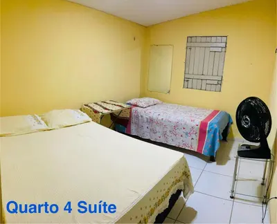 Uma cama ou camas num quarto em Paracuru Praia